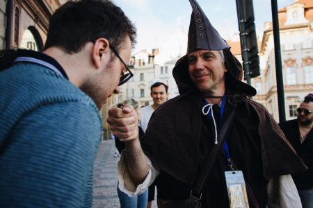 One person from the group is smelling a riddle sample from the Plague doctor